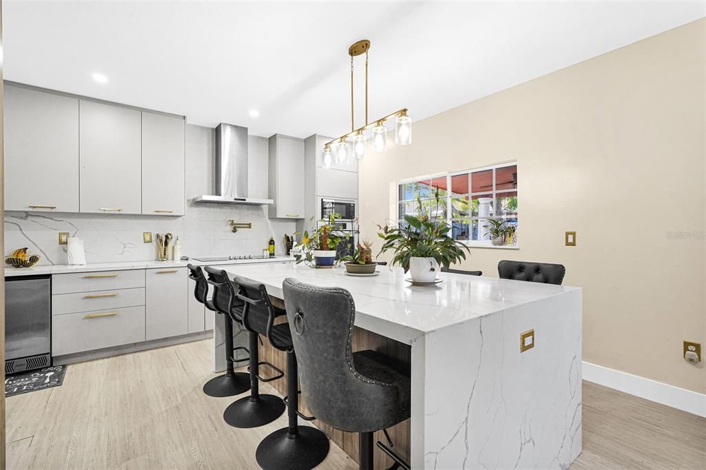 Interior, Kitchen, Marble Walls, Pendant Lights, Recessed Lighting, Stainless Steel Appliances, Wood Texture Flooring