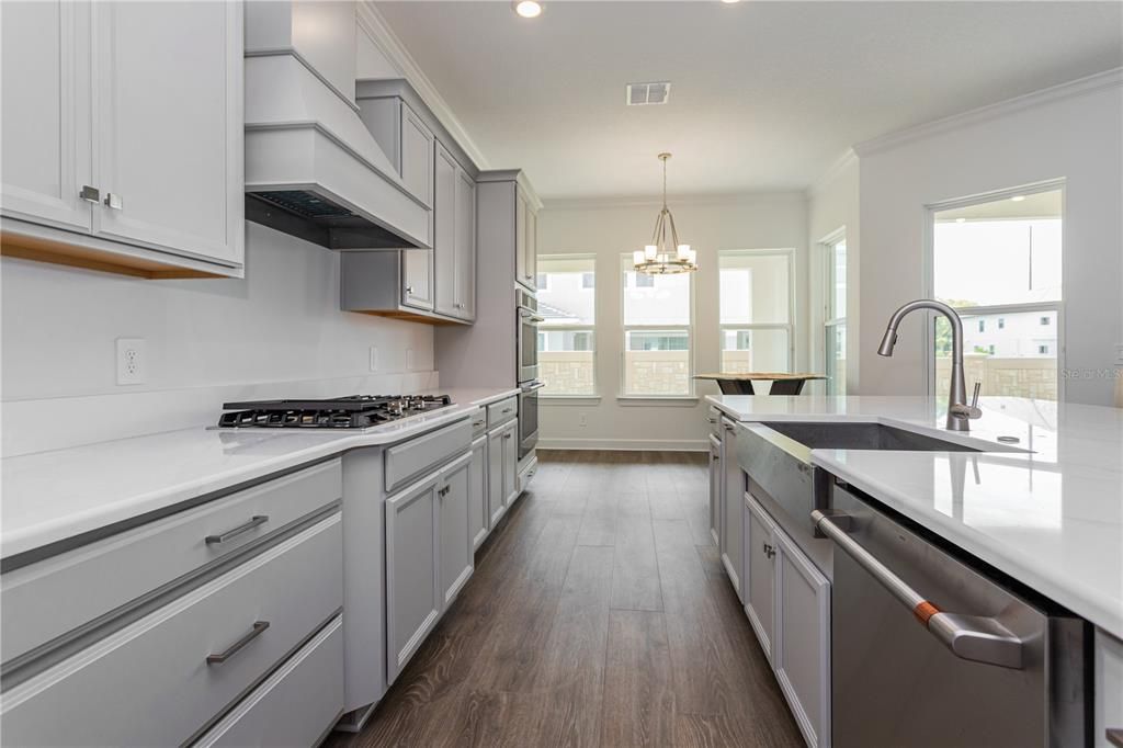 Chandelier, Interior, Kitchen, Pendant Lights, Recessed Lighting, Stainless Steel Appliances, Wood Texture Flooring