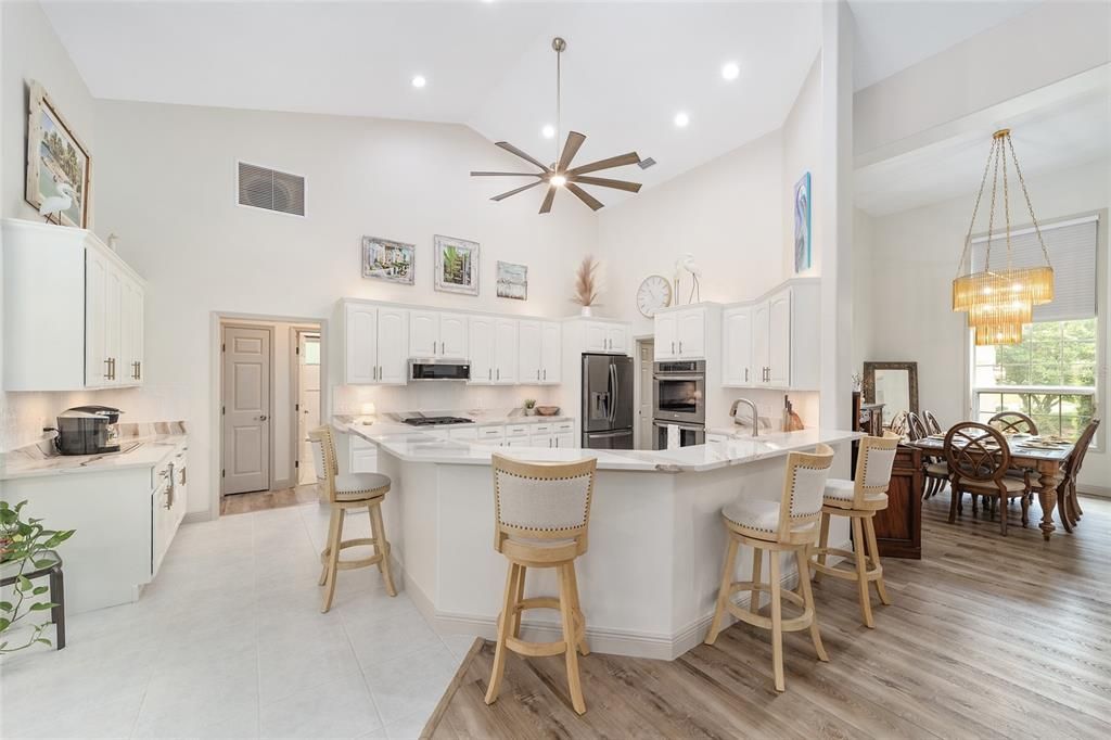 Chandelier, Dining room, Interior, Kitchen, Pendant Lights, Recessed Lighting, Stainless Steel Appliances, Wood Texture Flooring
