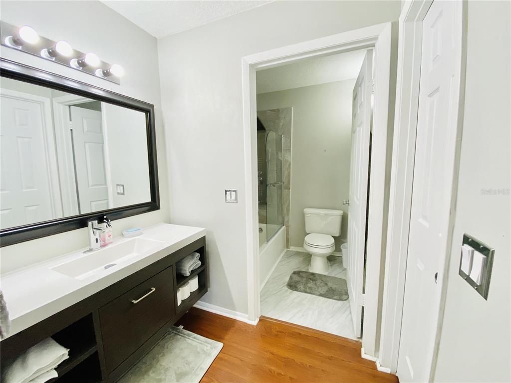 Bathroom, Dual Sink Vanities, Glass Shower, Interior, Wood Texture Flooring