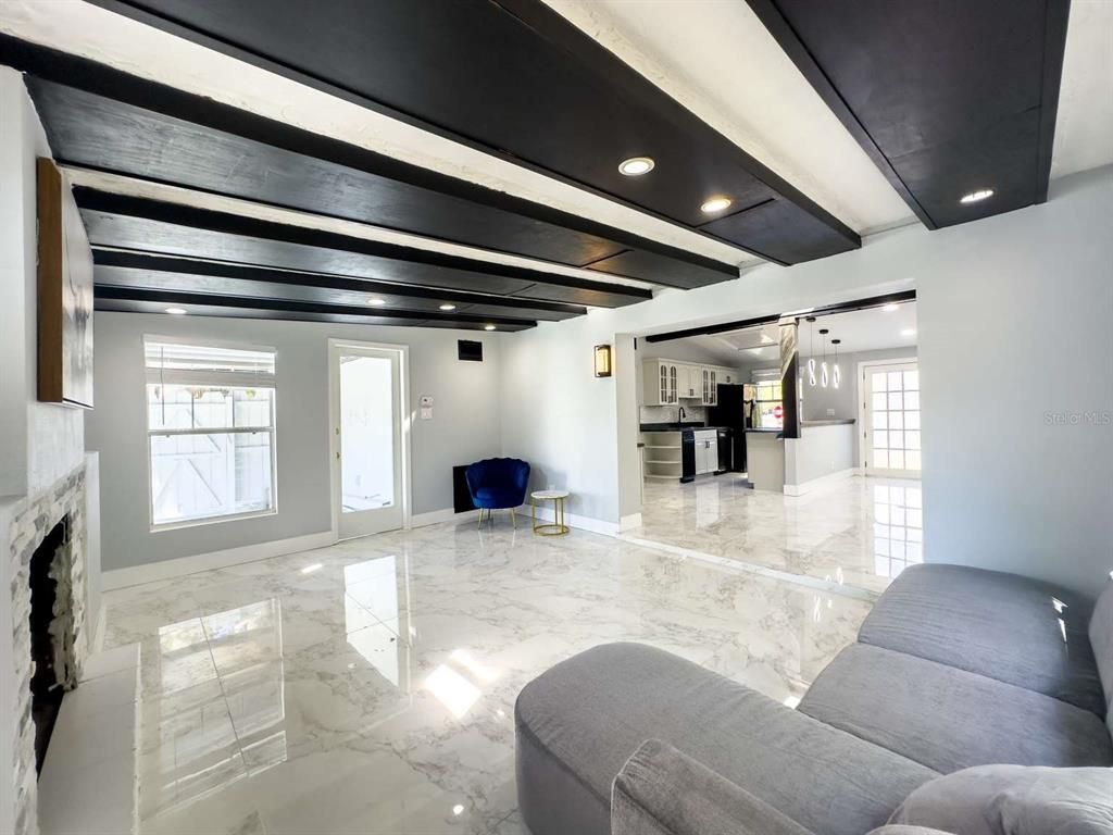 Fireplace, Interior, Living room, Marble, Pendant Lights, Recessed Lighting, Wooden Beams