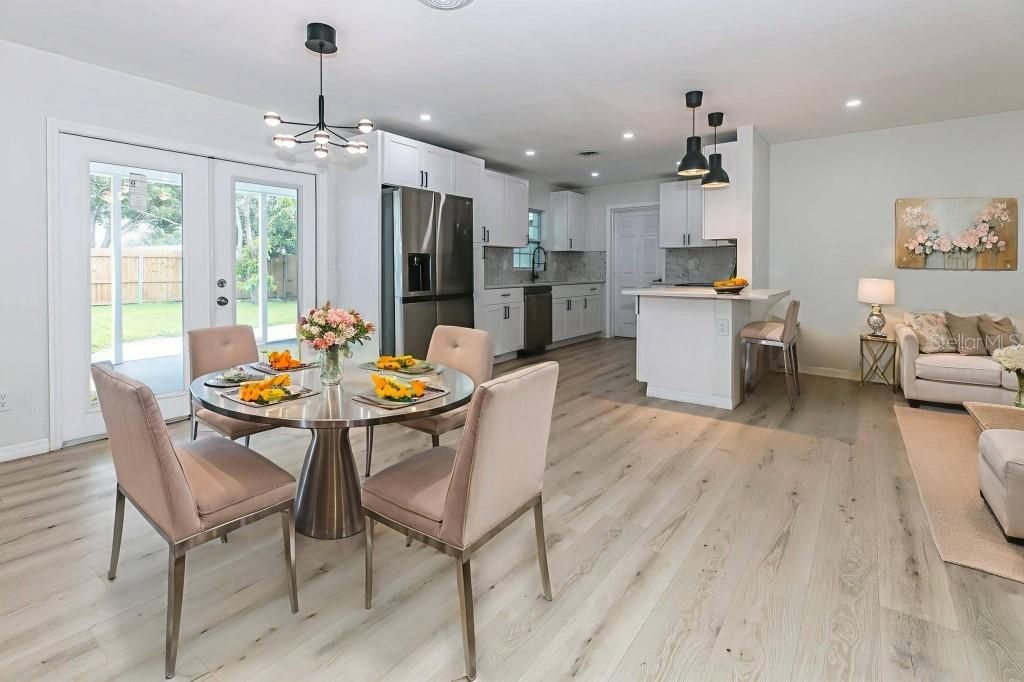 Dining room, Interior, Kitchen, Pendant Lights, Recessed Lighting, Stainless Steel Appliances, Wood Texture Flooring