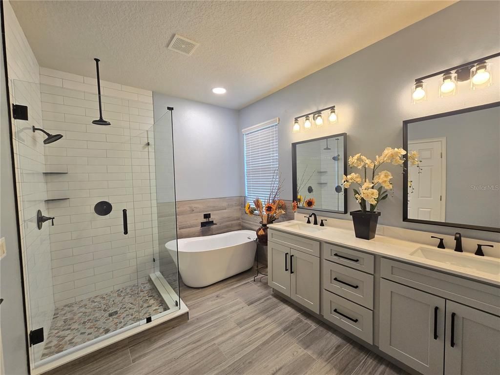 Bathroom, Dual Sink Vanities, Free Standing Baths, Glass Shower, Interior, Recessed Lighting, Wood Texture Flooring