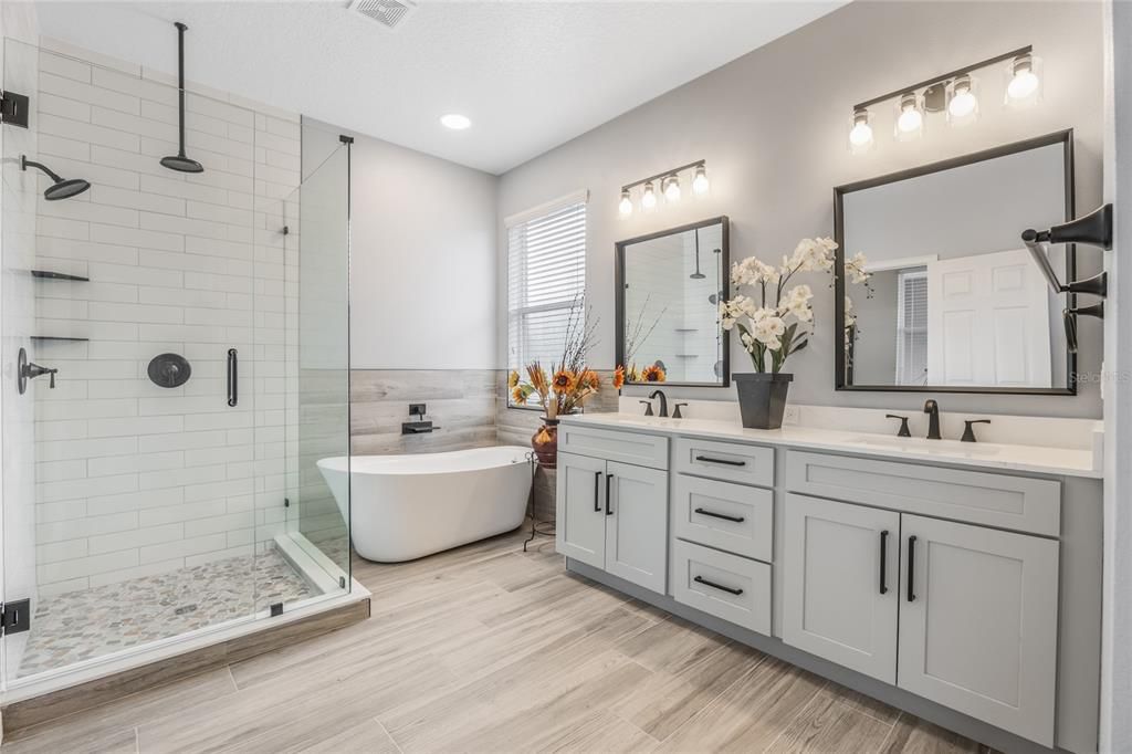 Bathroom, Dual Sink Vanities, Free Standing Baths, Glass Shower, Interior, Recessed Lighting, Wood Texture Flooring