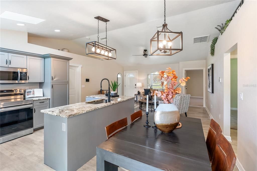 Dining room, Interior, Kitchen, Pendant Lights, Recessed Lighting, Stainless Steel Appliances, Wood Texture Flooring