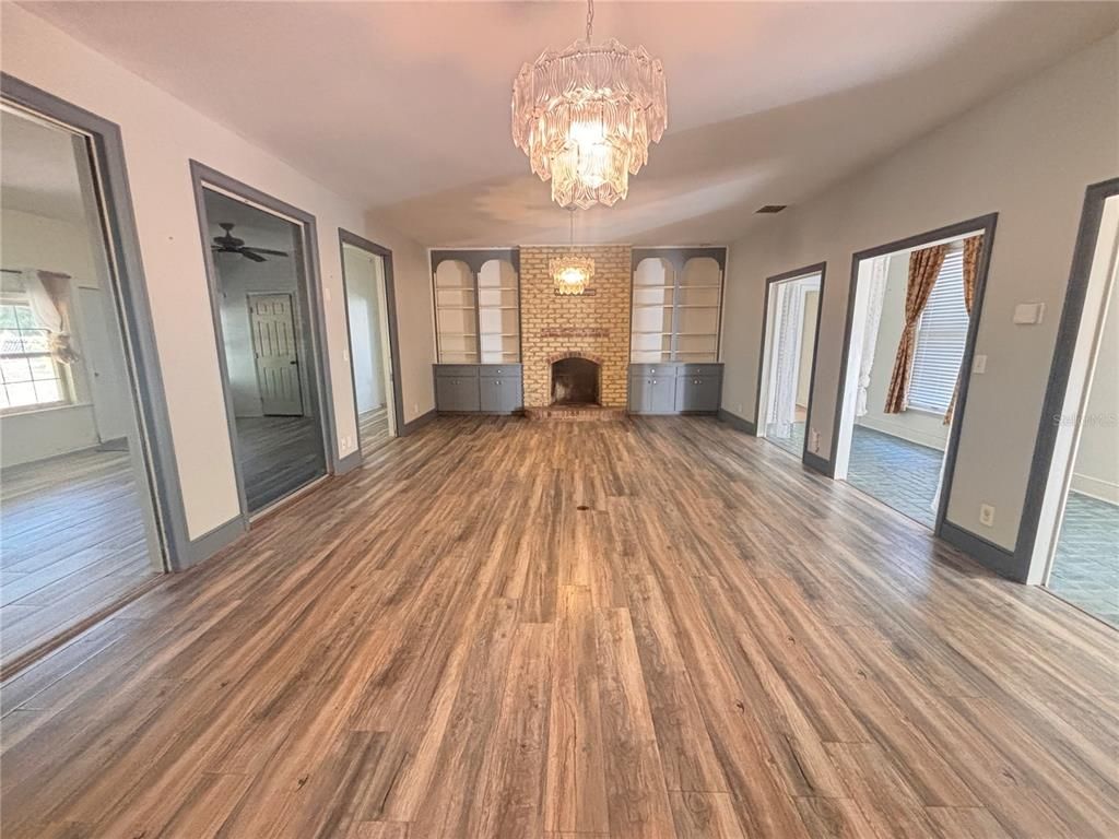Chandelier, Empty room, Fireplace, Interior, Wood Texture Flooring