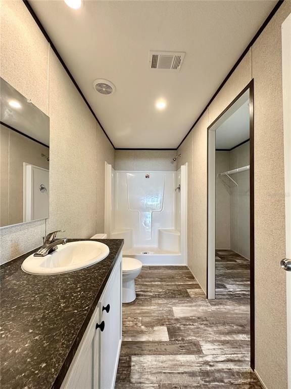 Bathroom, Dual Sink Vanities, Interior, Recessed Lighting, Wood Texture Flooring