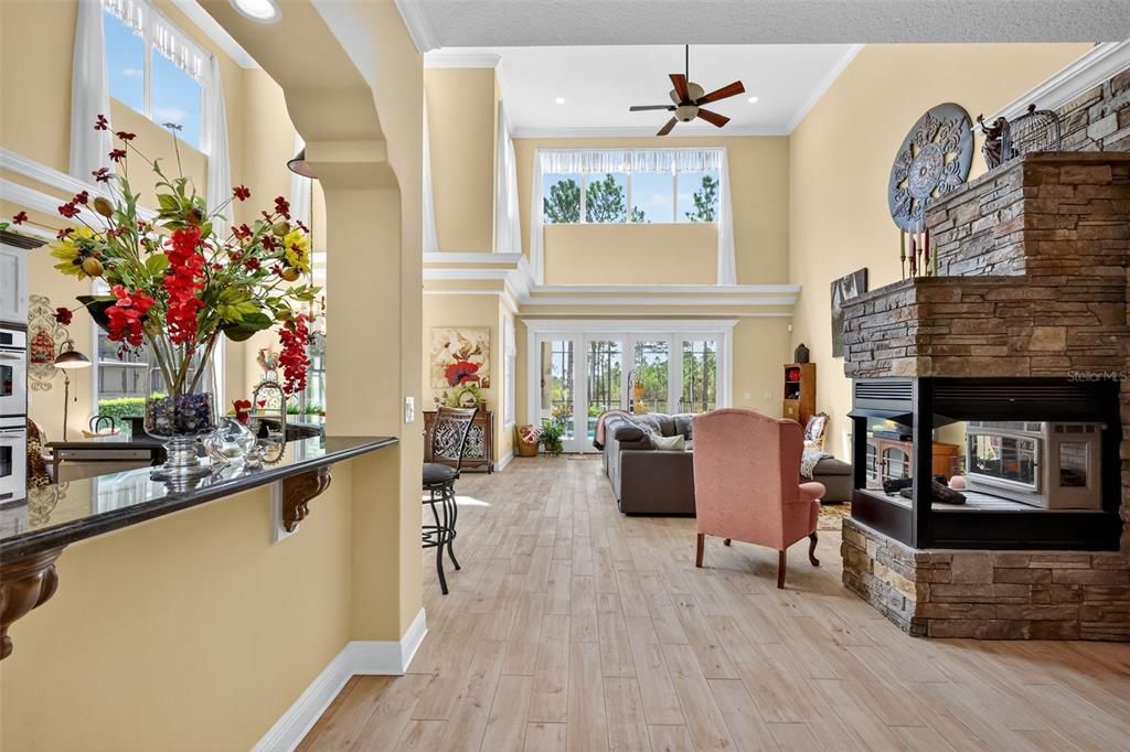 Fireplace, Interior, Living room, Recessed Lighting, Stone Walls, Wood Texture Flooring