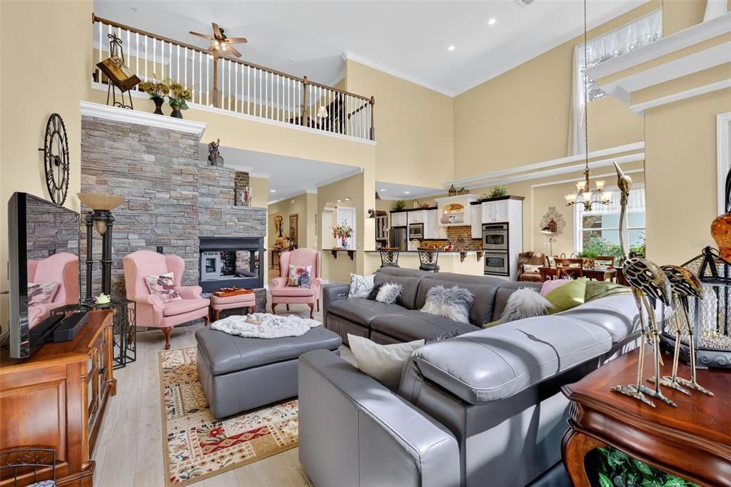 Chandelier, Dining room, Fireplace, Interior, Kitchen, Living room, Pendant Lights, Recessed Lighting, Stone Walls, Wood Texture Flooring