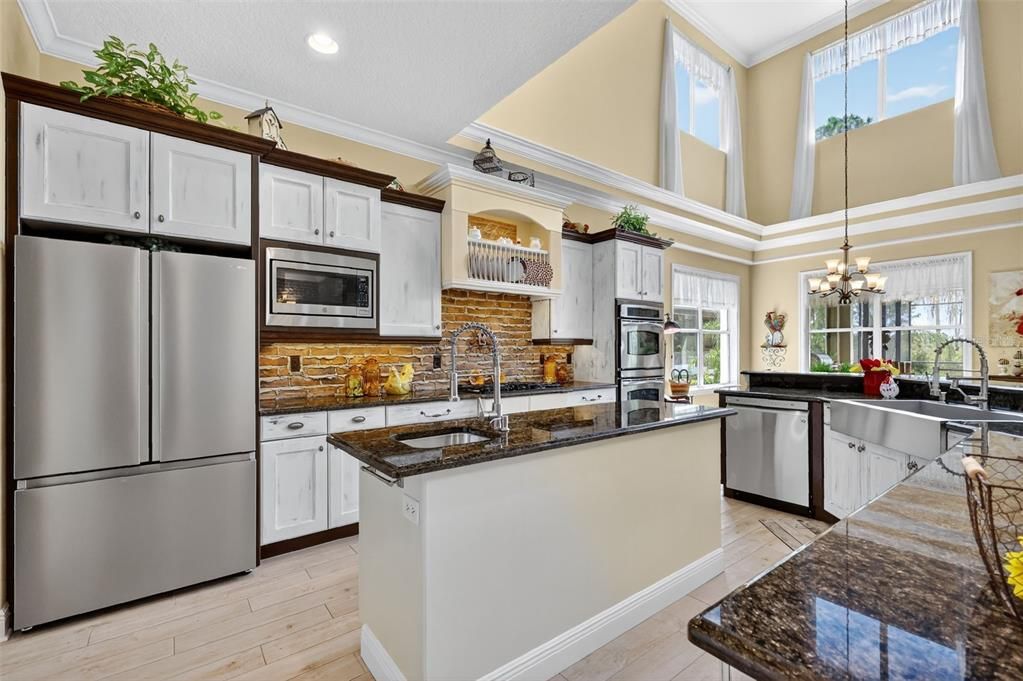 Chandelier, Interior, Kitchen, Pendant Lights, Recessed Lighting, Stainless Steel Appliances, Wood Texture Flooring