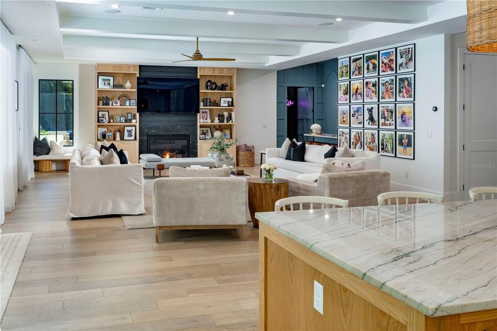 Dining room, Fireplace, Interior, Living room, Recessed Lighting, Wood Texture Flooring