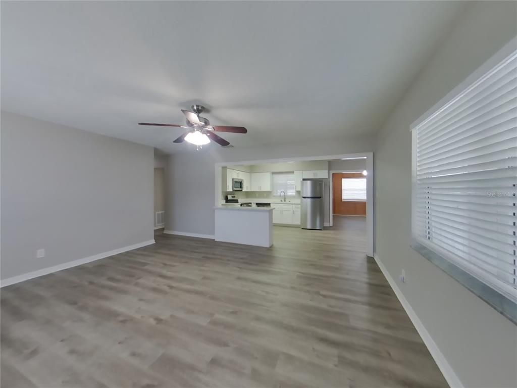 Empty room, Interior, Kitchen, Stainless Steel Appliances, Wood Texture Flooring