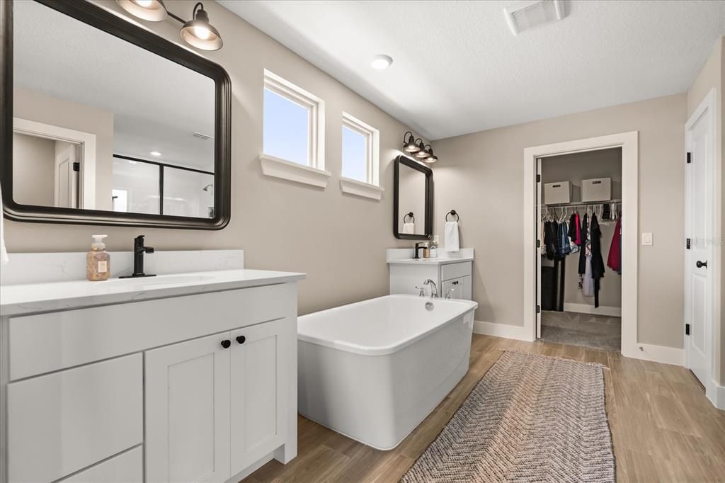 Bathroom, Dual Sink Vanities, Free Standing Baths, Interior, Recessed Lighting, Walk-in Closets, Wood Texture Flooring