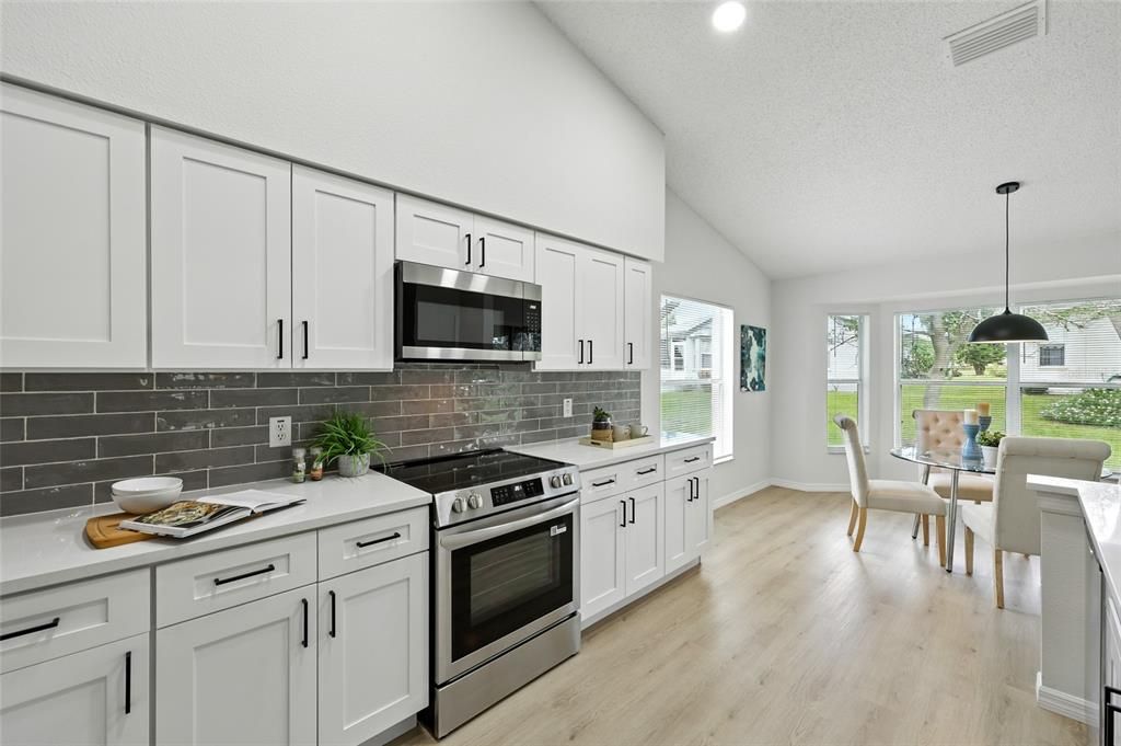 Dining room, Interior, Kitchen, Pendant Lights, Recessed Lighting, Stainless Steel Appliances, Wood Texture Flooring