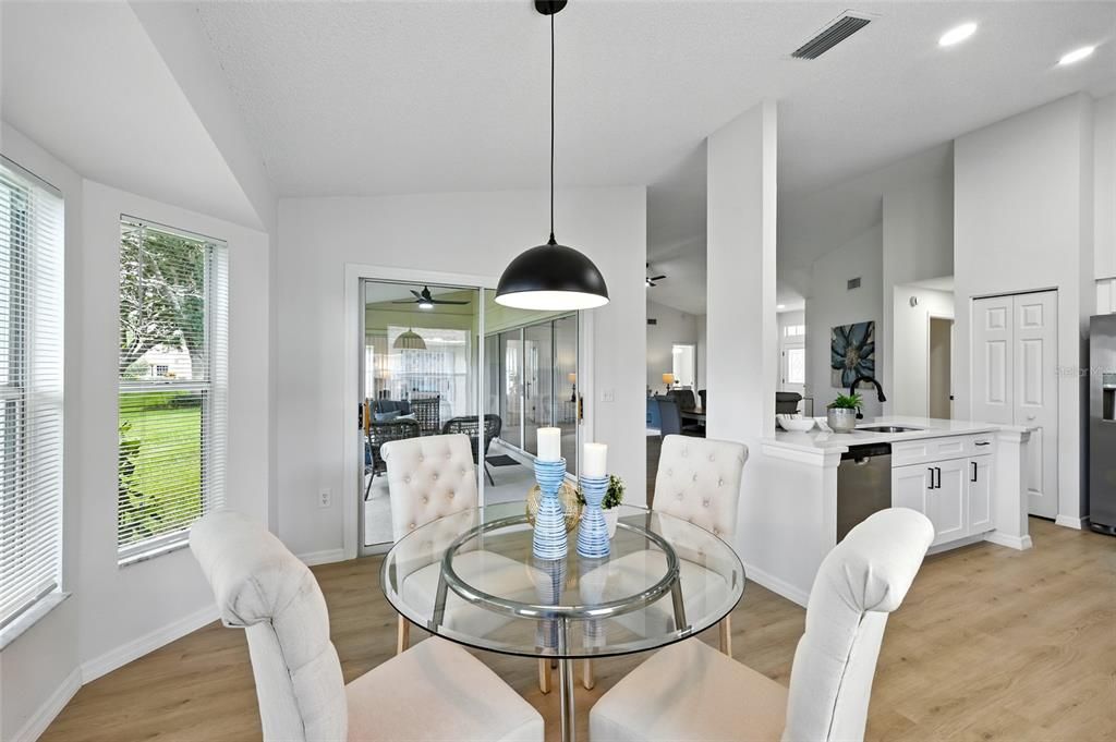Dining room, Interior, Kitchen, Pendant Lights, Recessed Lighting, Stainless Steel Appliances, Wood Texture Flooring