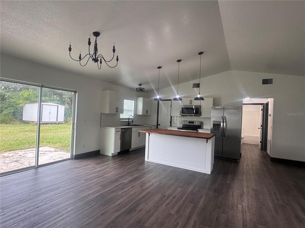 Chandelier, Interior, Kitchen, Pendant Lights, Stainless Steel Appliances, Wood Texture Flooring