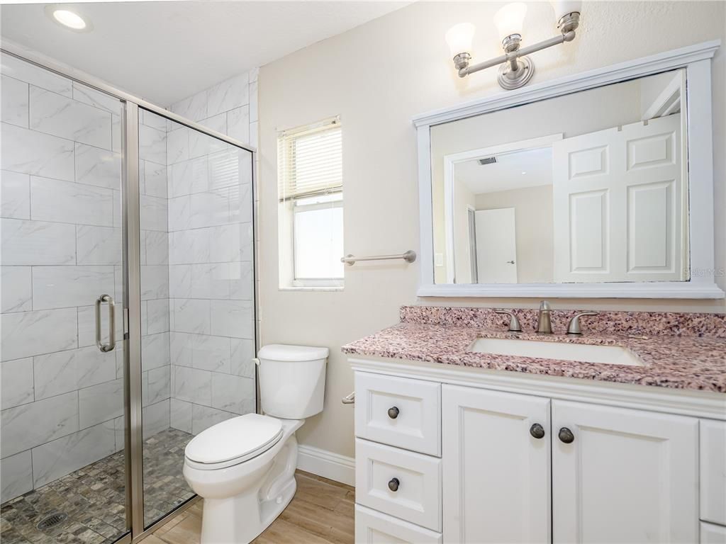 Bathroom, Glass Shower, Interior, Marble Walls, Recessed Lighting, Wood Texture Flooring