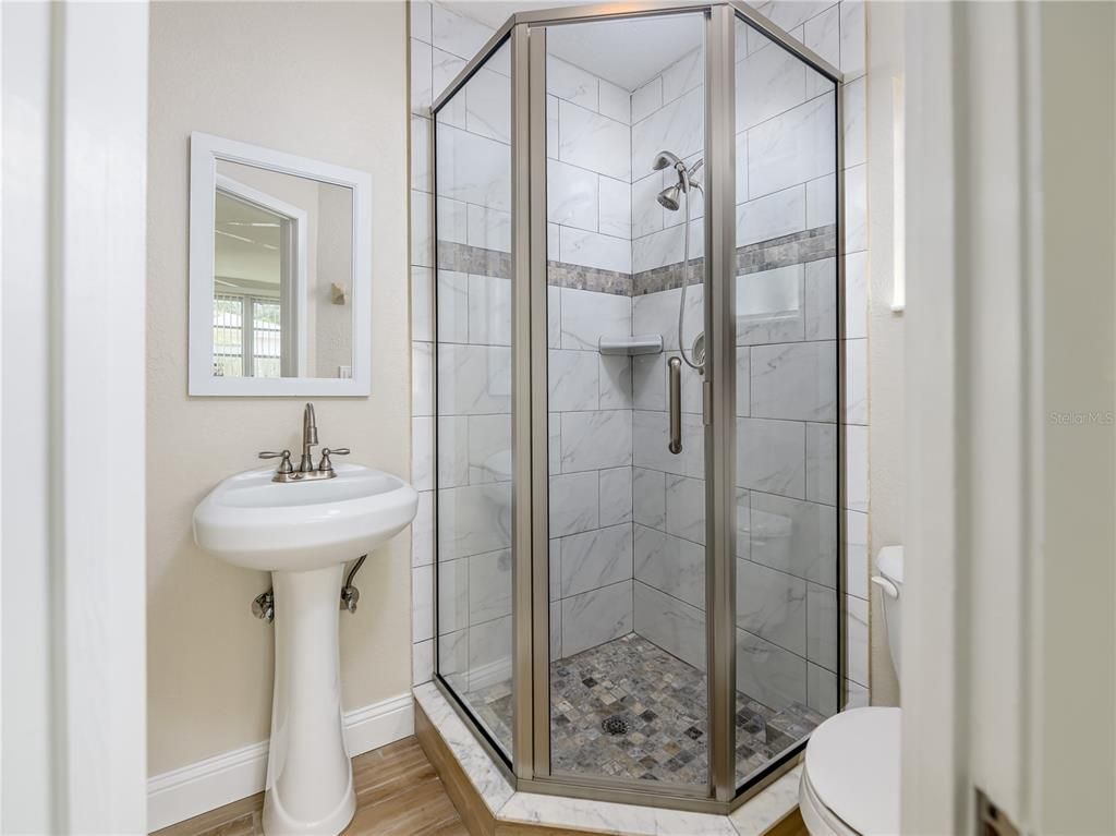 Bathroom, Glass Shower, Interior, Marble Walls, Wood Texture Flooring