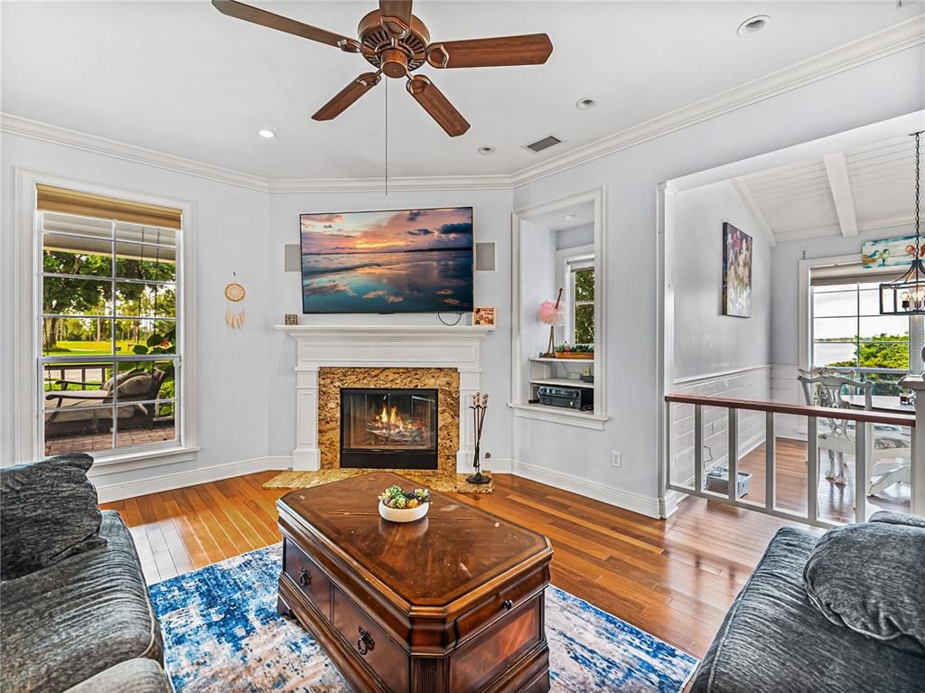 Dining room, Fireplace, Interior, Living room, Pendant Lights, Recessed Lighting, Wood Texture Flooring