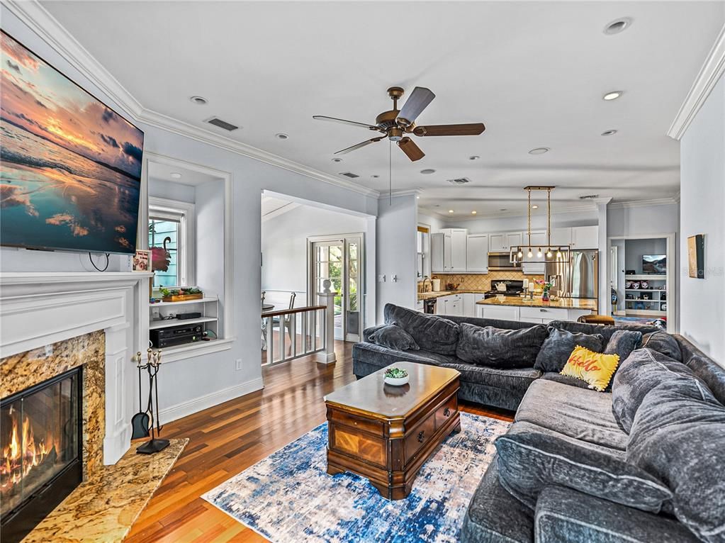 Fireplace, Interior, Kitchen, Living room, Pendant Lights, Recessed Lighting, Stainless Steel Appliances, Wood Texture Flooring