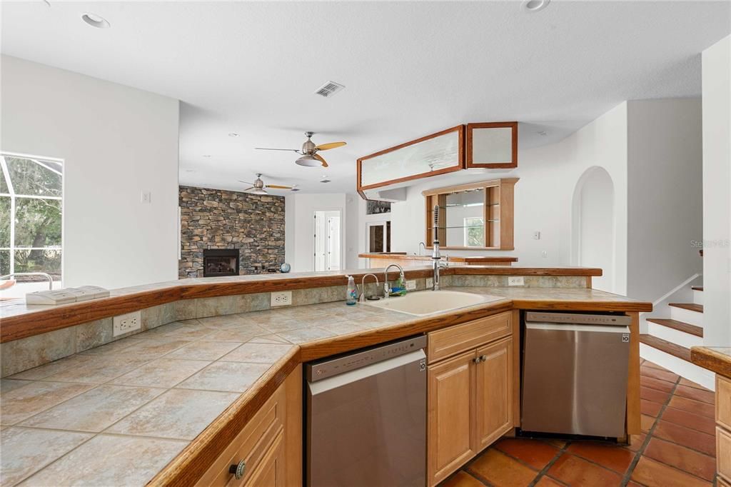 Fireplace, Interior, Kitchen, Recessed Lighting, Stone Walls, Tile Countertops