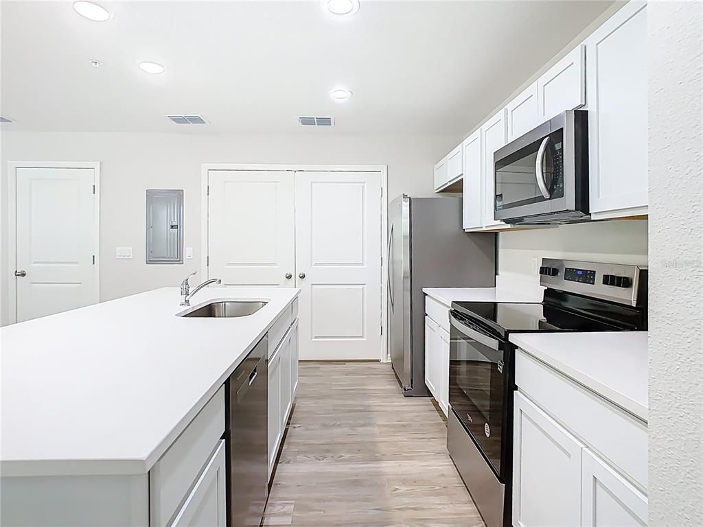 Interior, Kitchen, Recessed Lighting, Stainless Steel Appliances, Wood Texture Flooring