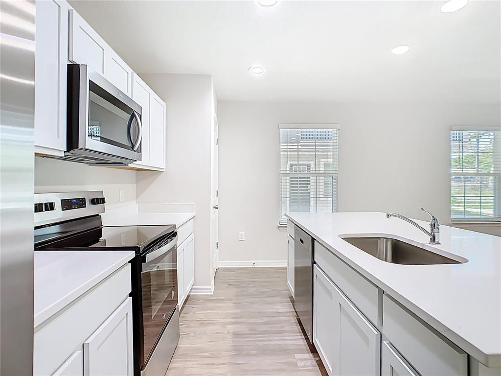 Interior, Kitchen, Recessed Lighting, Stainless Steel Appliances, Wood Texture Flooring