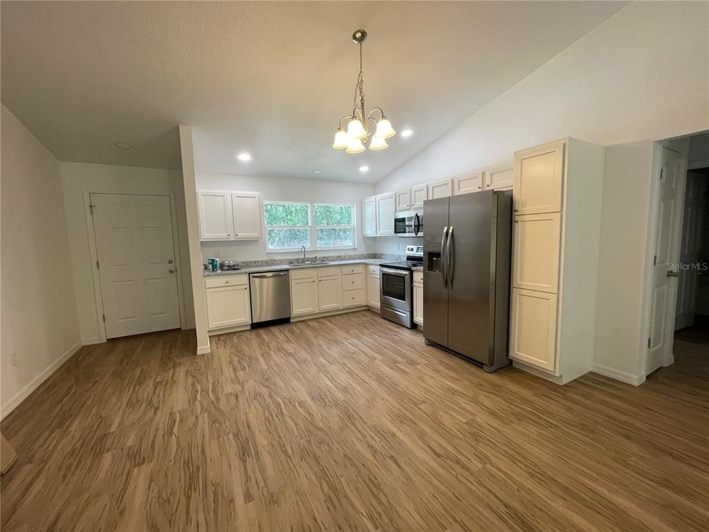 Interior, Kitchen, Pendant Lights, Recessed Lighting, Stainless Steel Appliances, Wood Texture Flooring