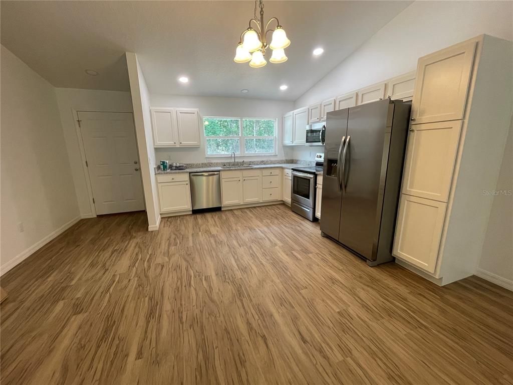 Interior, Kitchen, Pendant Lights, Recessed Lighting, Stainless Steel Appliances, Wood Texture Flooring