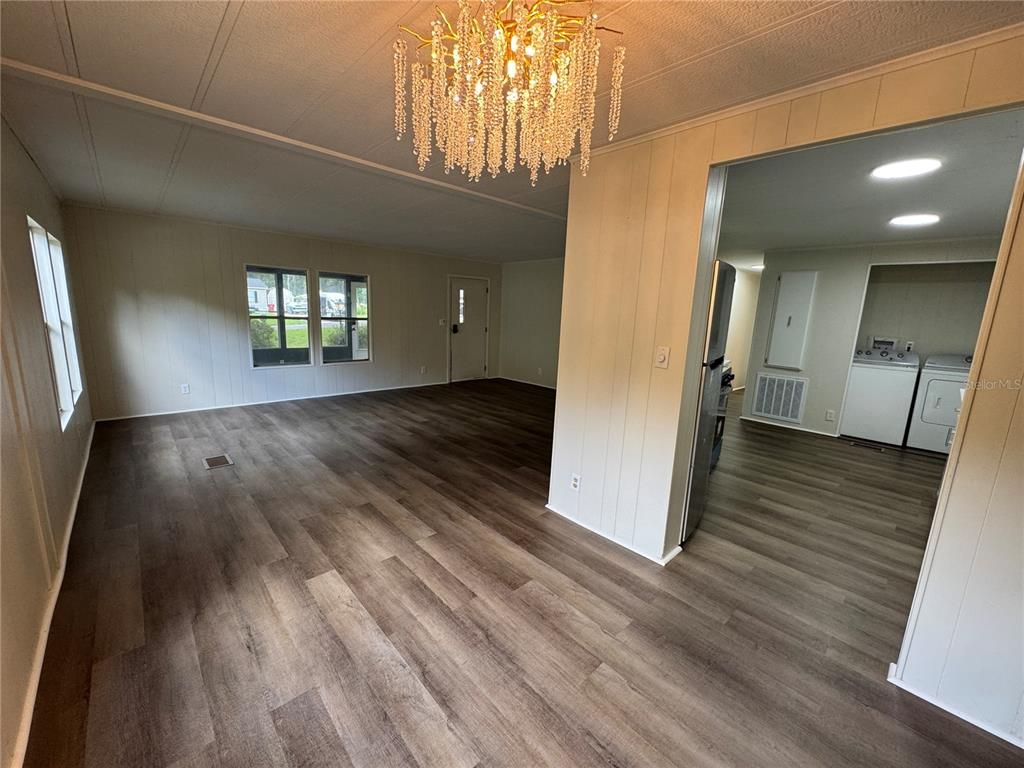 Chandelier, Empty room, Interior, Recessed Lighting, Washer, Wood Texture Flooring