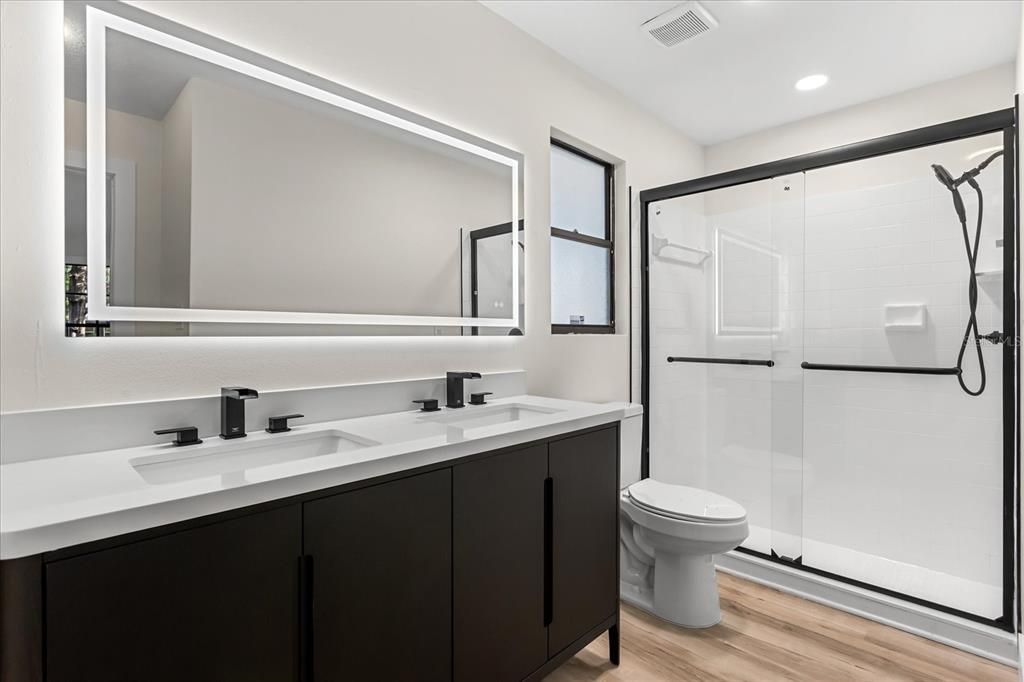 Bathroom, Dual Sink Vanities, Glass Shower, Interior, Recessed Lighting, Wood Texture Flooring