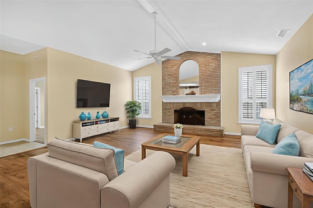 Fireplace, Interior, Living room, Recessed Lighting, Stone Walls, Wood Texture Flooring