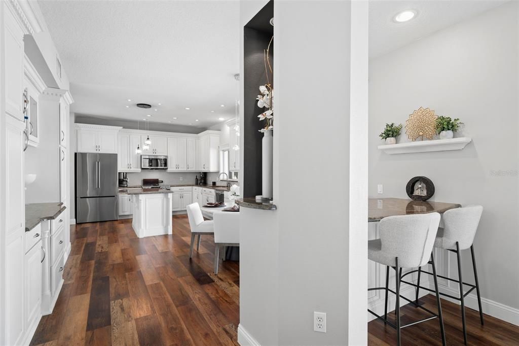 Dining room, Interior, Kitchen, Pendant Lights, Recessed Lighting, Stainless Steel Appliances, Wood Texture Flooring