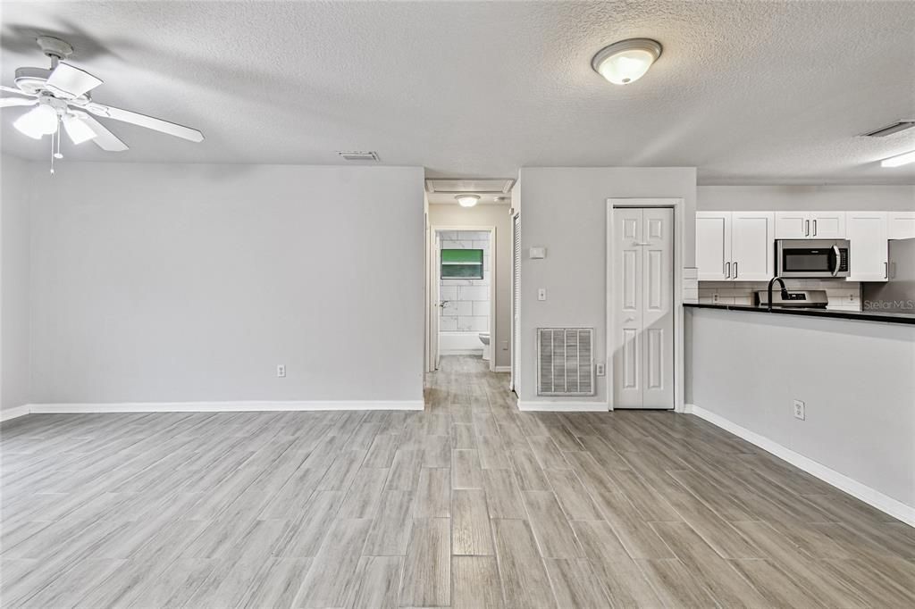 Empty room, Interior, Kitchen, Stainless Steel Appliances, Wood Texture Flooring