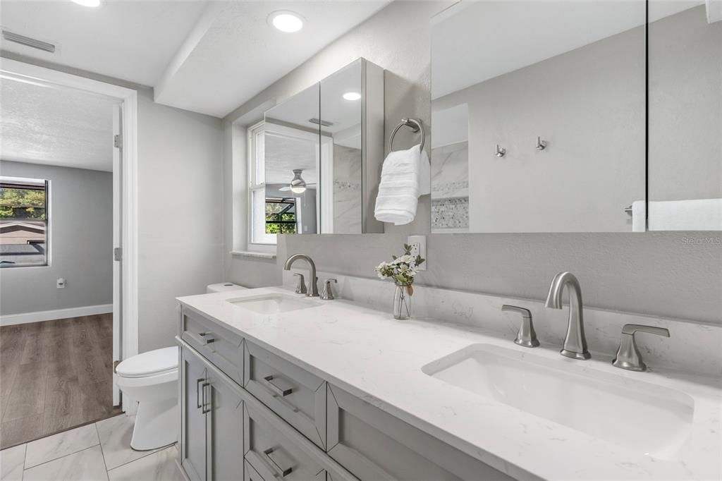Bathroom, Dual Sink Vanities, Interior, Marble, Recessed Lighting, Wood Texture Flooring