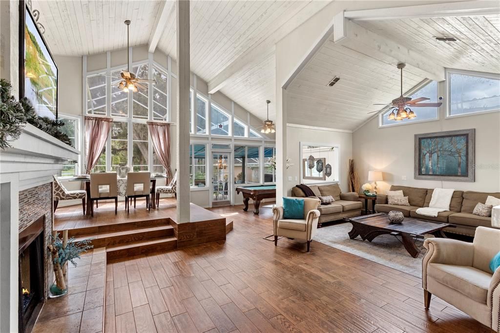 Billiard Table, Dining room, Fireplace, Game Room, Interior, Living room, Pendant Lights, Wood Texture Flooring
