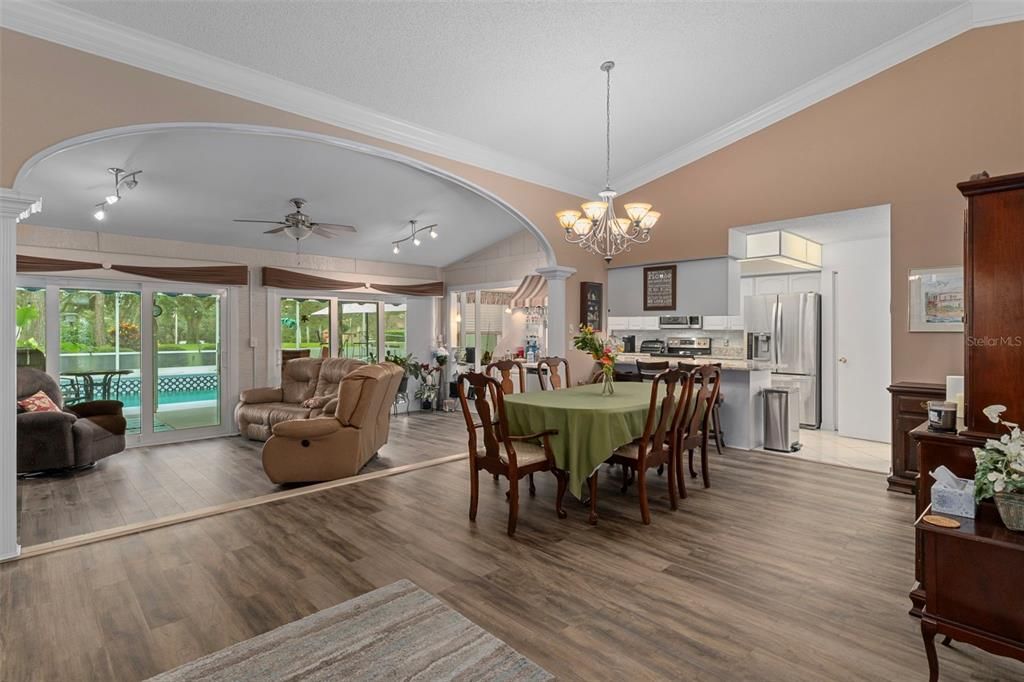 Chandelier, Dining room, Interior, Kitchen, Living room, Stainless Steel Appliances, Wood Texture Flooring