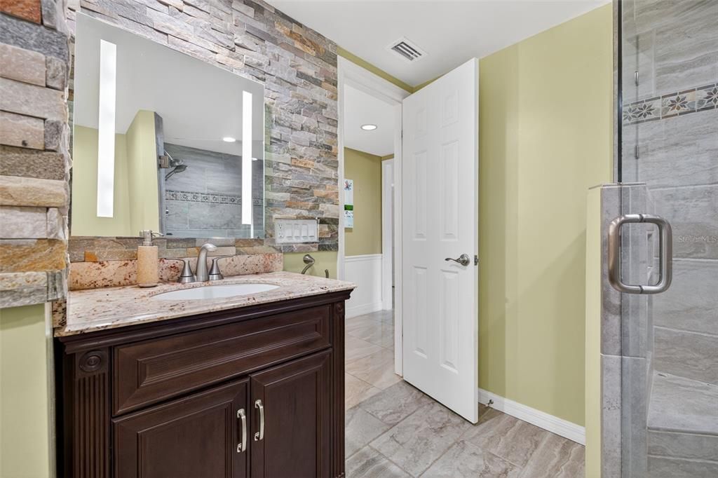 Bathroom, Glass Shower, Interior, Recessed Lighting, Stone Walls