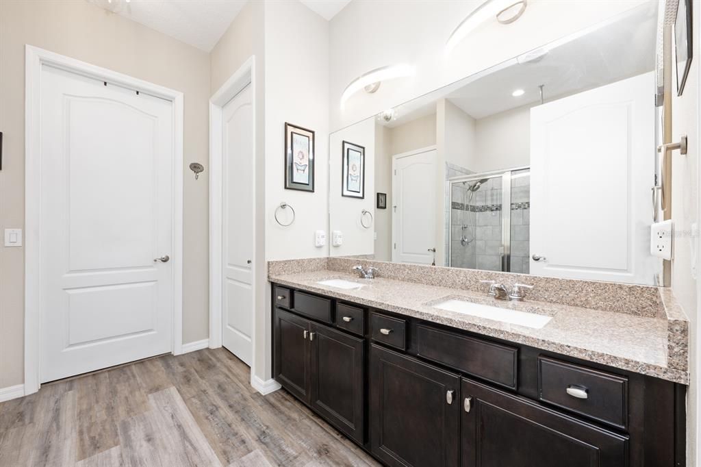 Bathroom, Dual Sink Vanities, Glass Shower, Interior, Recessed Lighting, Wood Texture Flooring