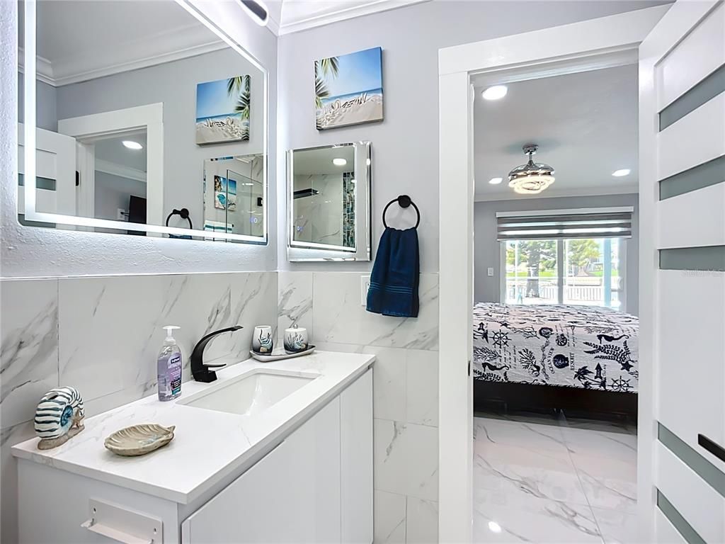 Bathroom, Dual Sink Vanities, Interior, Marble, Marble Walls, Recessed Lighting