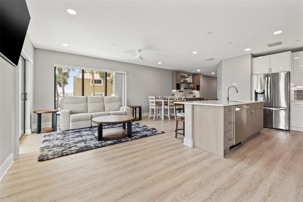 Dining room, Interior, Kitchen, Living room, Recessed Lighting, Stainless Steel Appliances, Wood Texture Flooring