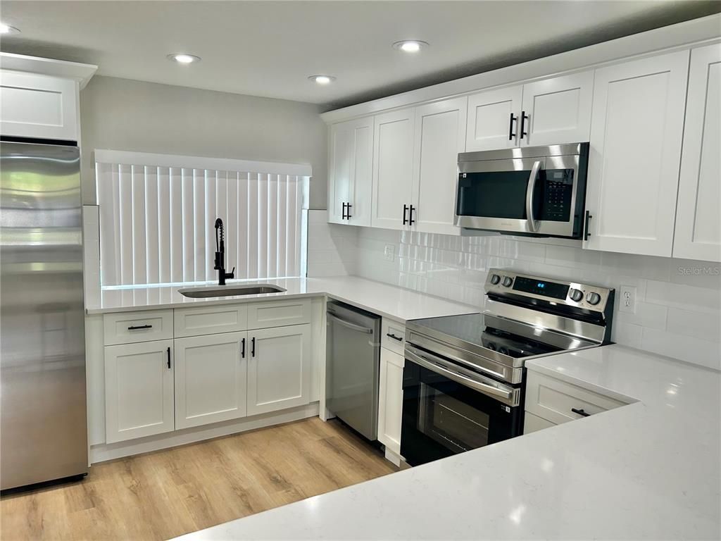 Interior, Kitchen, Recessed Lighting, Stainless Steel Appliances, Wood Texture Flooring
