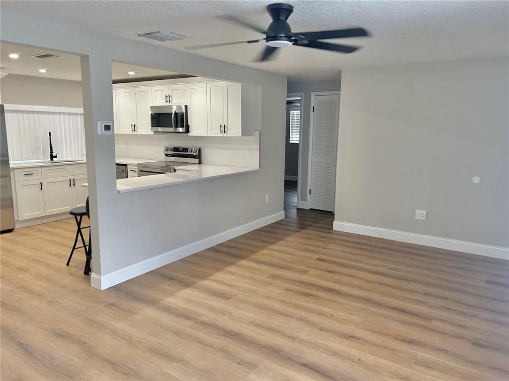 Interior, Kitchen, Recessed Lighting, Stainless Steel Appliances, Wood Texture Flooring