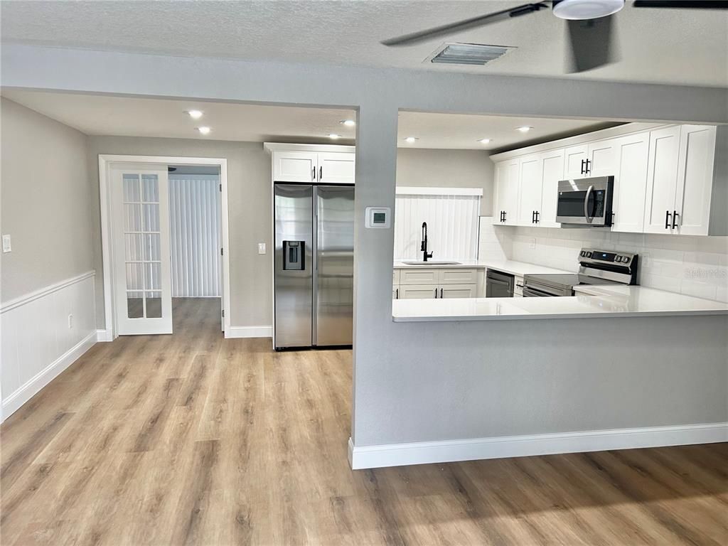 Interior, Kitchen, Recessed Lighting, Stainless Steel Appliances, Wood Texture Flooring