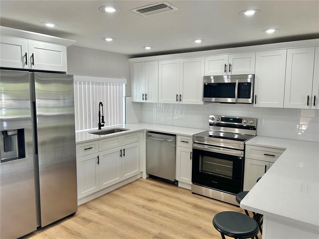 Interior, Kitchen, Recessed Lighting, Stainless Steel Appliances, Wood Texture Flooring