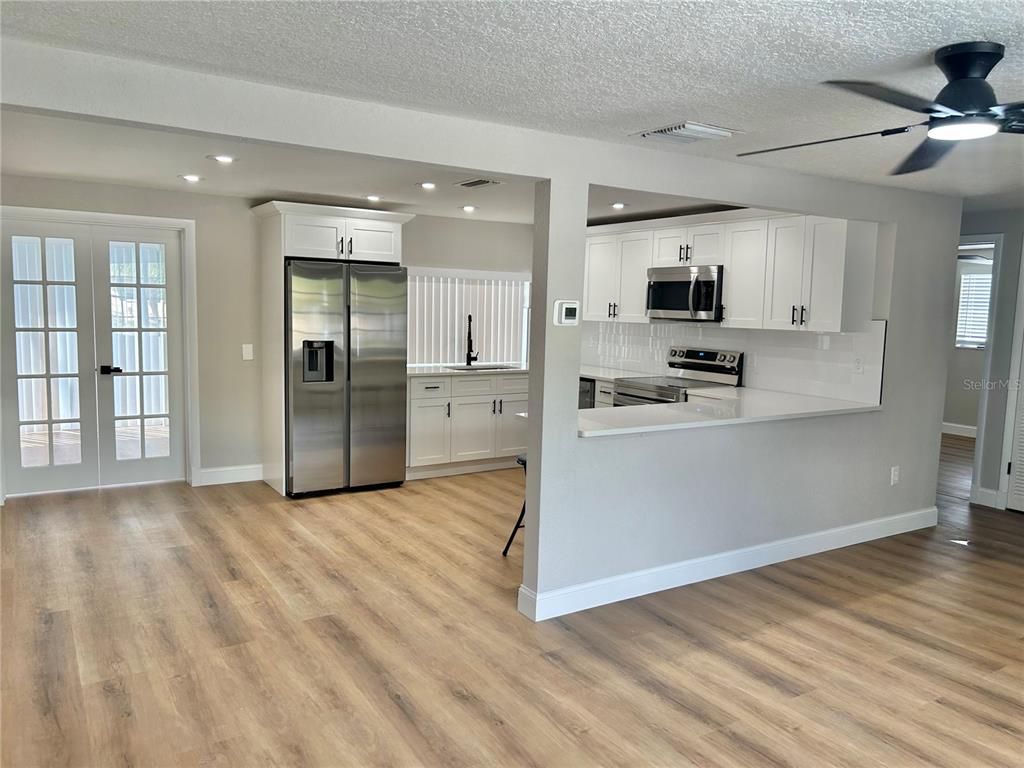 Interior, Kitchen, Recessed Lighting, Stainless Steel Appliances, Wood Texture Flooring