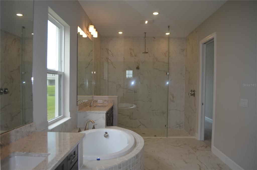 Bathroom, Dual Sink Vanities, Glass Shower, Interior, Marble, Marble Walls, Recessed Lighting