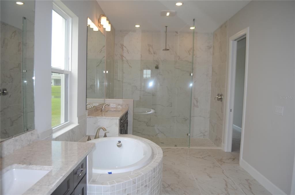 Bathroom, Dual Sink Vanities, Glass Shower, Interior, Marble, Marble Walls, Recessed Lighting