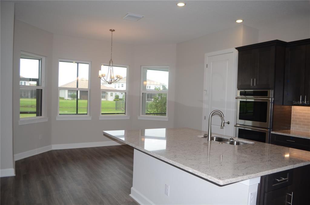 Chandelier, Interior, Kitchen, Recessed Lighting, Stainless Steel Appliances, Wood Texture Flooring