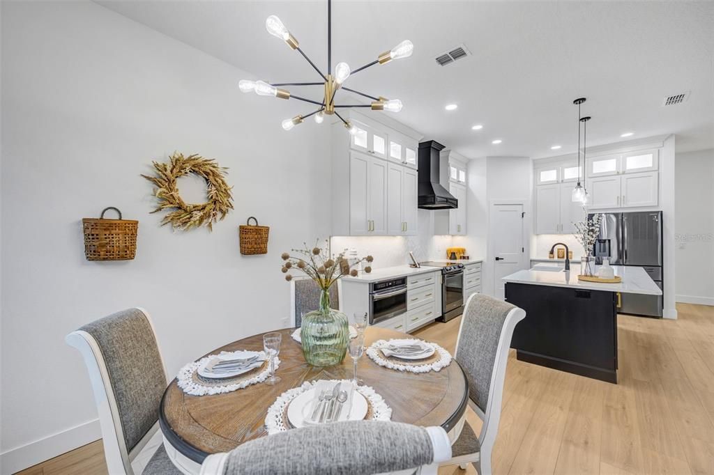 Dining room, Interior, Kitchen, Pendant Lights, Recessed Lighting, Stainless Steel Appliances, Wood Texture Flooring
